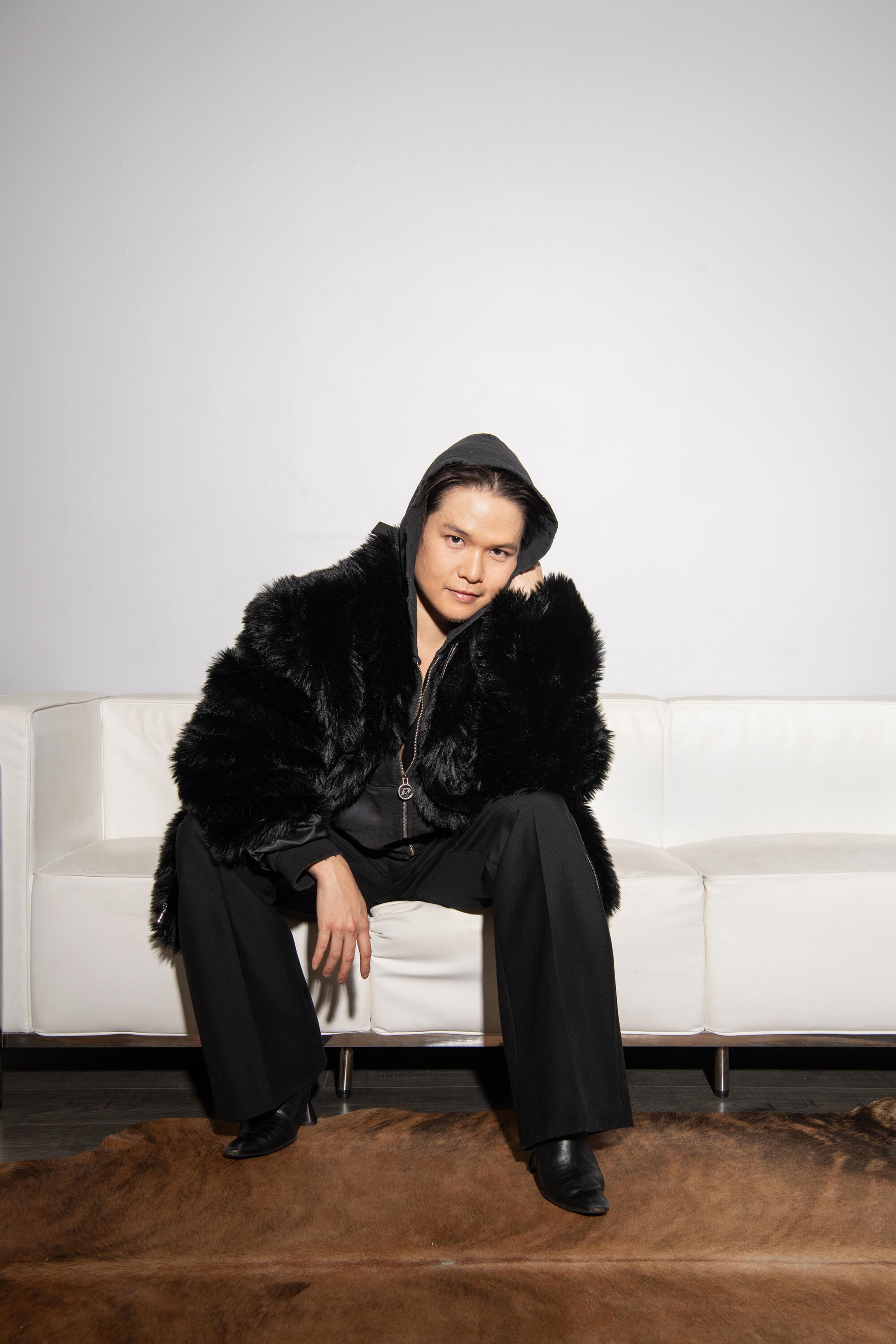 Bin wears RTA faux fur coat, BoohooMan jacket, Bottega Veneta pants, Dora Teymur boots.
