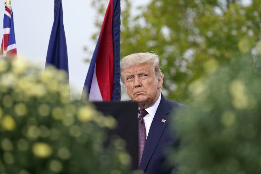 President Donald Trump sits on stage at a 19th anniversary observance of the Sept. 11 terror attacks, at the Flight 93 National Memorial in Shanksville, Pa., Friday, Sept. 11, 2020. (AP Photo/Alex Brandon)