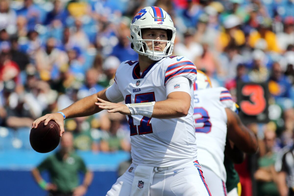 FILE - In this Saturday, Aug. 28, 2021, file photo, Buffalo Bills quarterback Josh Allen throws a pass during a preseason NFL football game in Orchard Park, N.Y. In describing Steelers quarterback Ben Roethlisberger's rugged ability to extend plays and make unorthodox throws, Bills starter Josh Allen could have been describing himself. The two open the season facing off against each other on Sunday, when Buffalo hosts Pittsburgh in a matchup of two defending division champs. (AP Photo/Jeffrey T. Barnes, File)