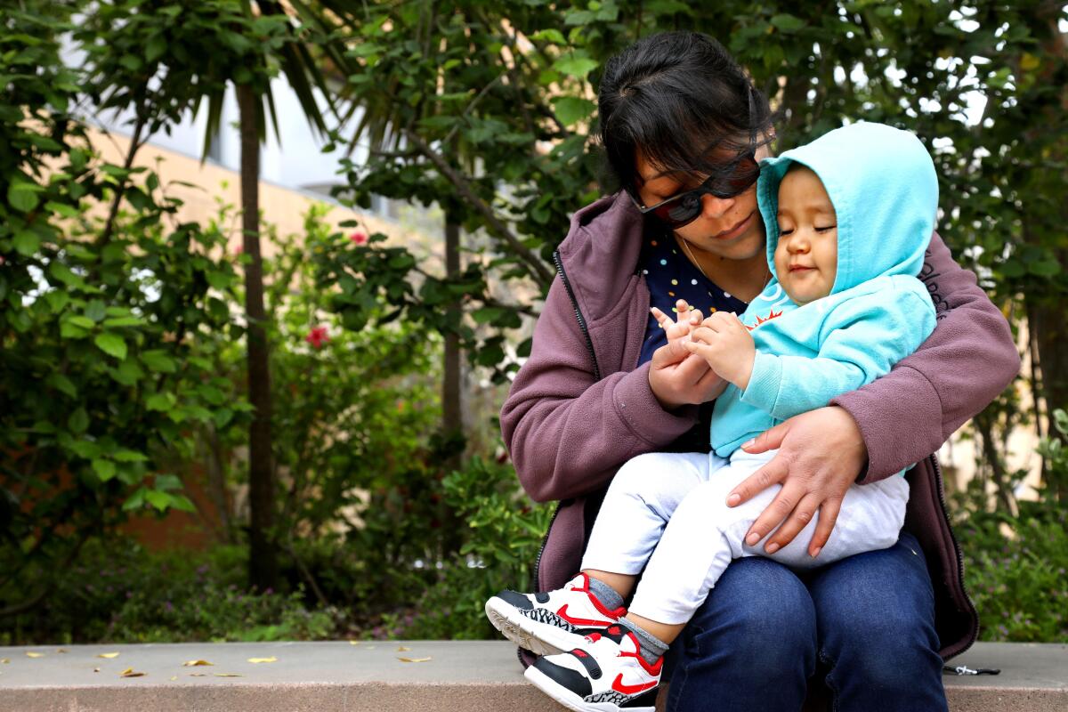 Sarahi Varela Lopez holds her son.