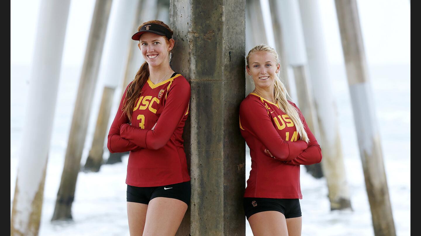 USC's Kelly Claes (3), left , and Sara Hughes (14), pose for photographs at the USA Volleyball Collegiate Beach Championships in Hermosa Beach on May 12.