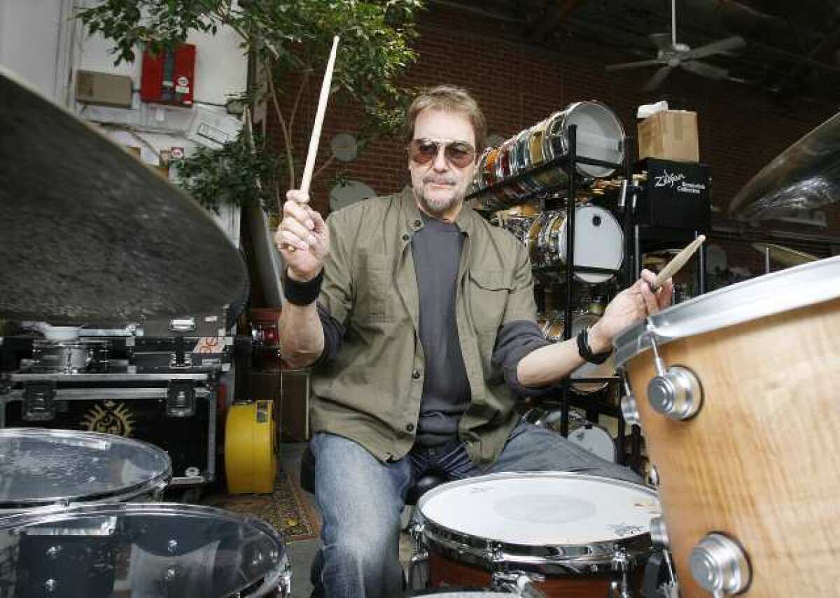 Acclaimed rock drummer Jim Keltner, who has played on major albums by Bob Dylan, John Lennon, Neil Young and many others, sits for a photo at Drum Doctors in Glendale.