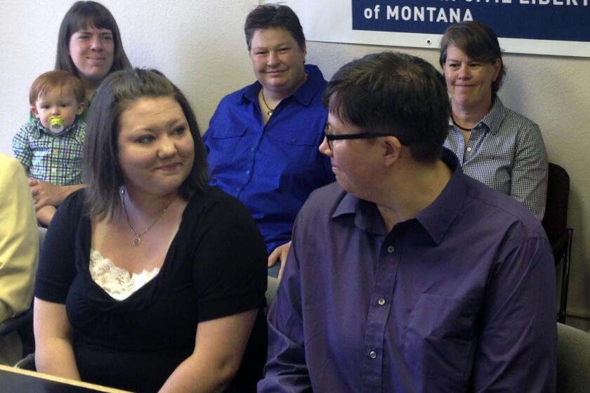 Tonya and Angie Rolando of Great Falls, Mont., in May. They and three other couples have filed a lawsuit challenging the state's same-sex marriage ban.