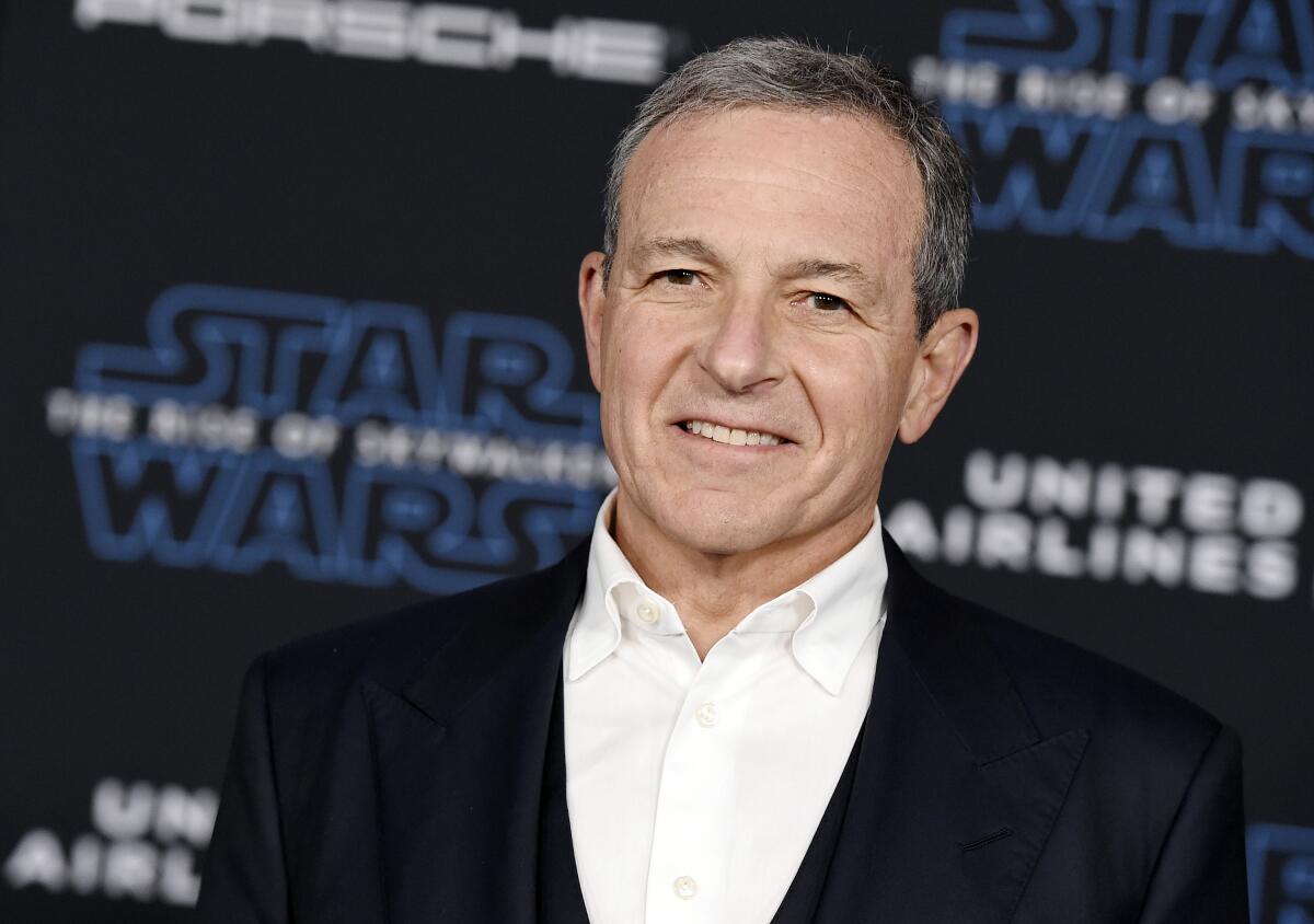 Disney CEO Bob Iger before a backdrop that says, "Star Wars: The Rise of Skywalker"