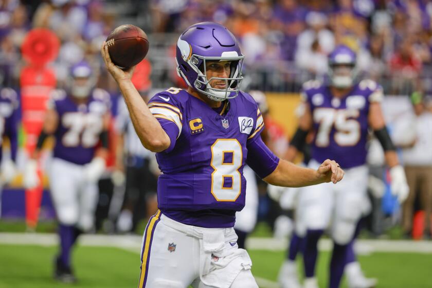 Minnesota Vikings quarterback Kirk Cousins (8) passes against the Tampa Bay Buccaneers during the first half of an NFL football game s, Sunday, Sept. 10, 2023, in Minneapolis. (AP Photo/Bruce Kluckhohn)