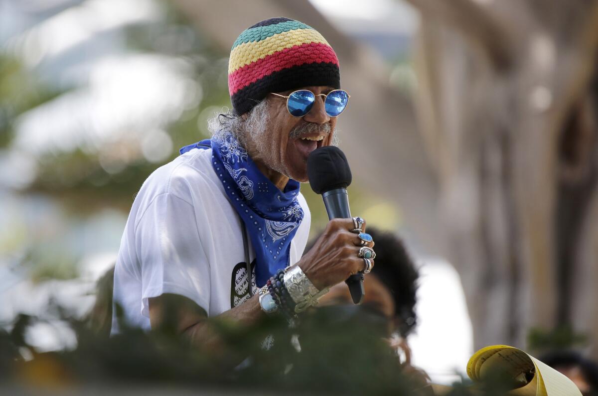 Speaker Dr. Karamo Chilombo of Los Angeles rallies those in attendance at the Juneteenth event at Sasscer Park.