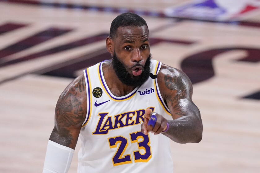 Lakers star LeBron James signals during a game against the Houston Rockets on Sept. 12.