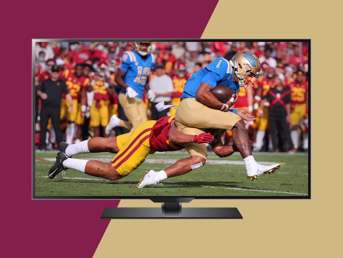 A tv screen shows a USC football player tackling a UCLA player.