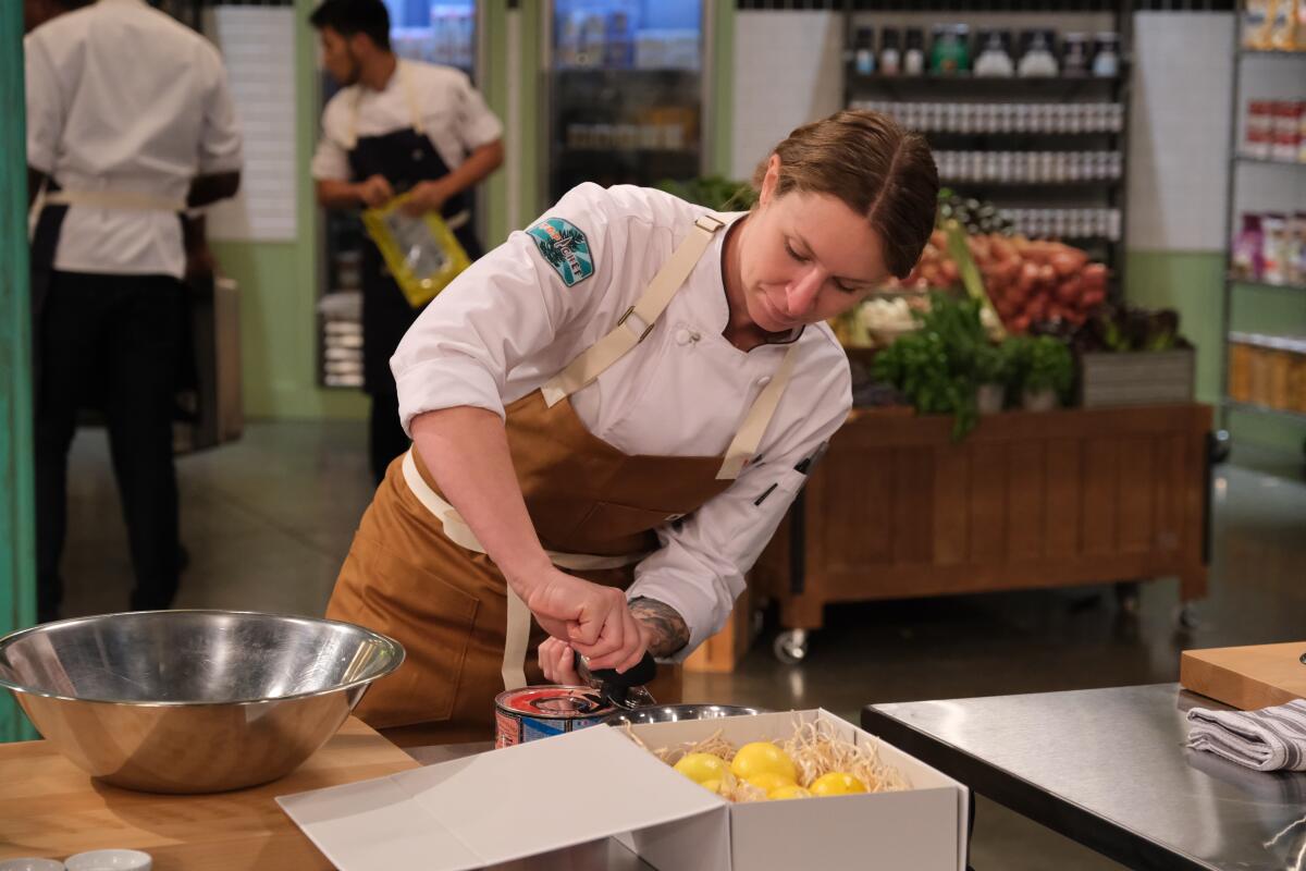 Cheftestant Sara Hauman opens a can on Bravo's "Top Chef" Season 18, debuting April 1.