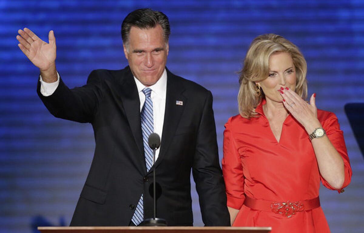 Ann Romney blows a kiss after being greeted by her husband Republican presidential nominee Mitt Romney on stage the Republican National Convention in Tampa, Fla.