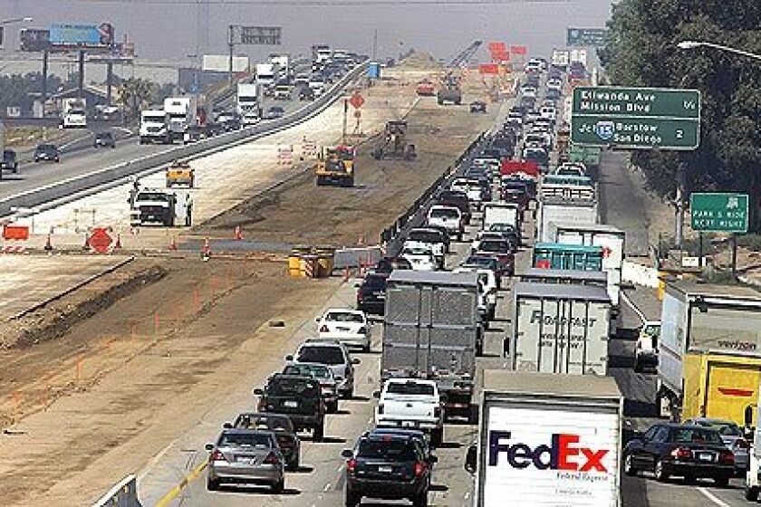 RELIEF IN SIGHT: Carpool lanes are under construction on the Pomona Freeway in Riverside. In January, Caltrans will begin work on adding carpool lanes to the 11 miles between the Orange and 605