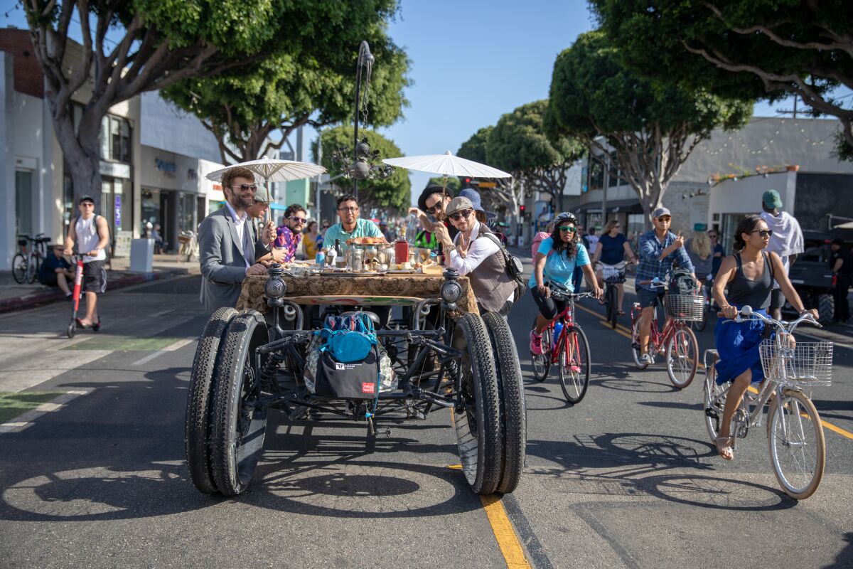Ride your bicycle (or a dining table on wheels) down two miles of car-free Santa Monica streets pm Sept. 15 during COAST.