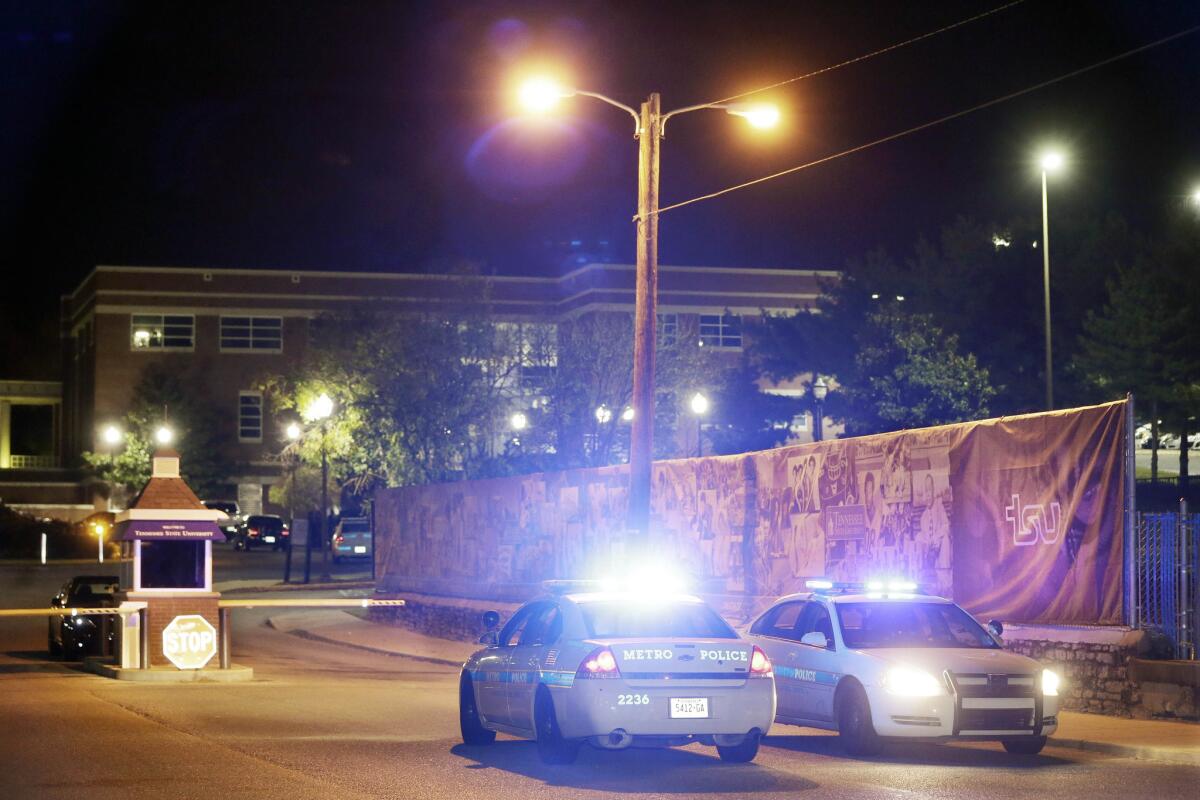 Police guard the main entrance to Tennessee State University in Nashville on Oct. 23 as officials investigate the scene of a campus shooting.