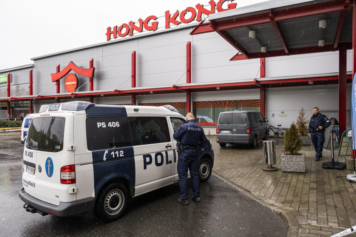 Police respond to an incident at a shopping center in Kuopio, Finland, on Tuesday.