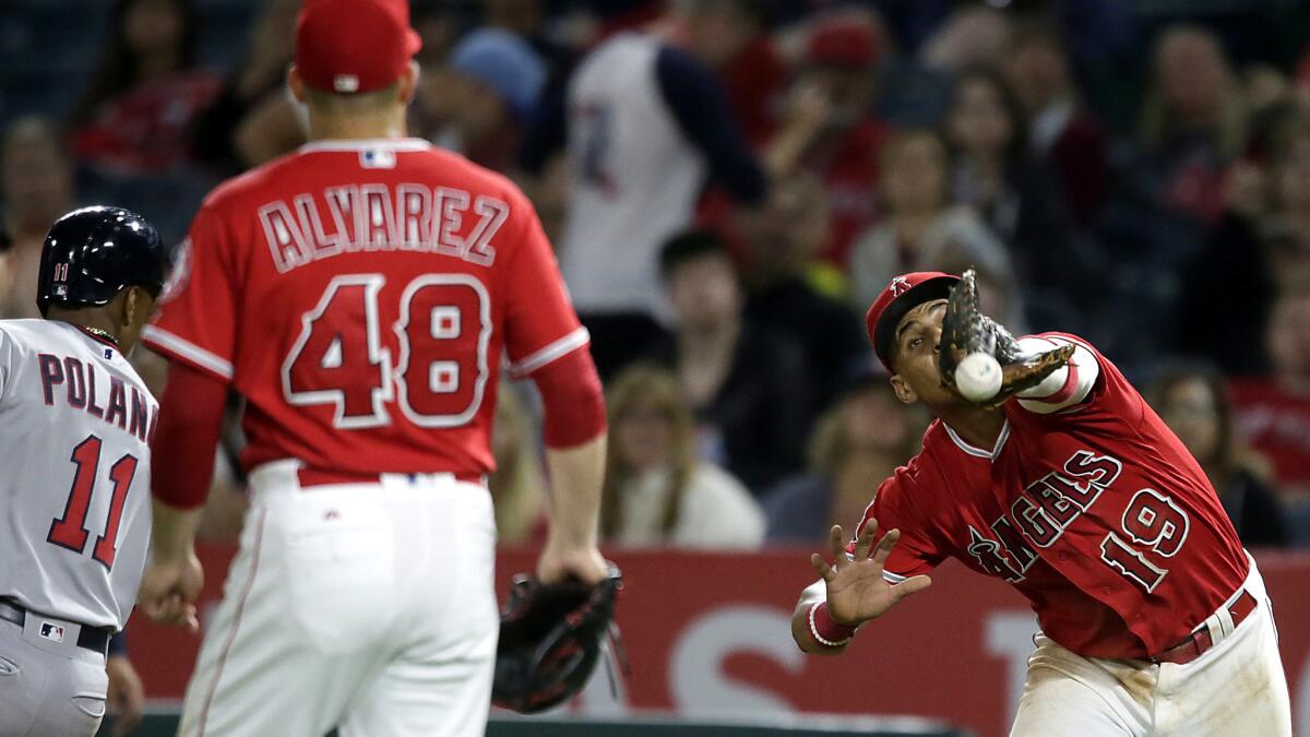 Angels first baseman Jefry Marte drops a pop fly hit by Twins shortstop Jorge Polanco for an error in the ninth inning error Thursday night at Angel Stadium.