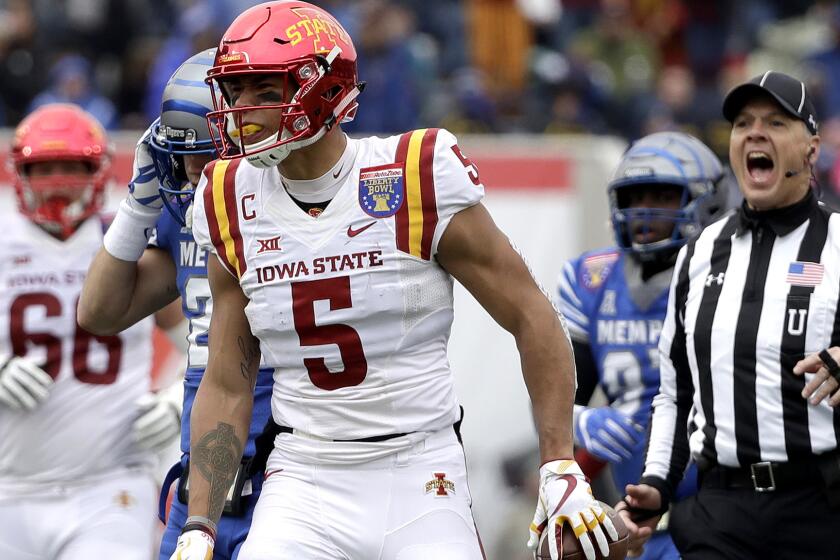Iowa State wide receiver Allen Lazard (5) walks back to the huddle after making a reception against Memphis during the first half of the Liberty Bowl NCAA college football game Saturday, Dec. 30, 2017, in Memphis, Tenn. Lazard tied a Liberty Bowl record with 10 catches as Iowa State won 21-20. (AP Photo/Mark Humphrey)