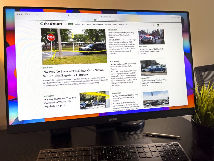 The home page of the Onion is seen on a computer display.
