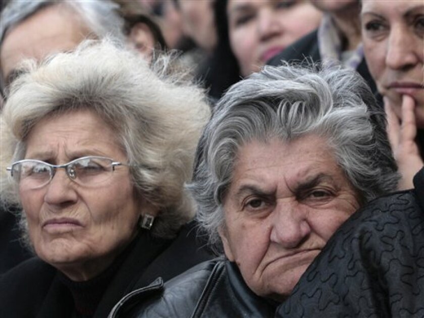 Demonstrators attend an opposition rally outside the Georgian parliament in the capital Tbilisi, Georgia, Wednesday, May 6, 2009. Opposition supporters continue to hold protests in Georgia's capital aimed at forcing President Mikhail Saakashvili to step down. (AP Photo/Shakh Aivazov)