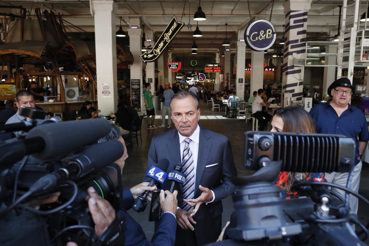 Rick Caruso fields media questions on Thursday. 