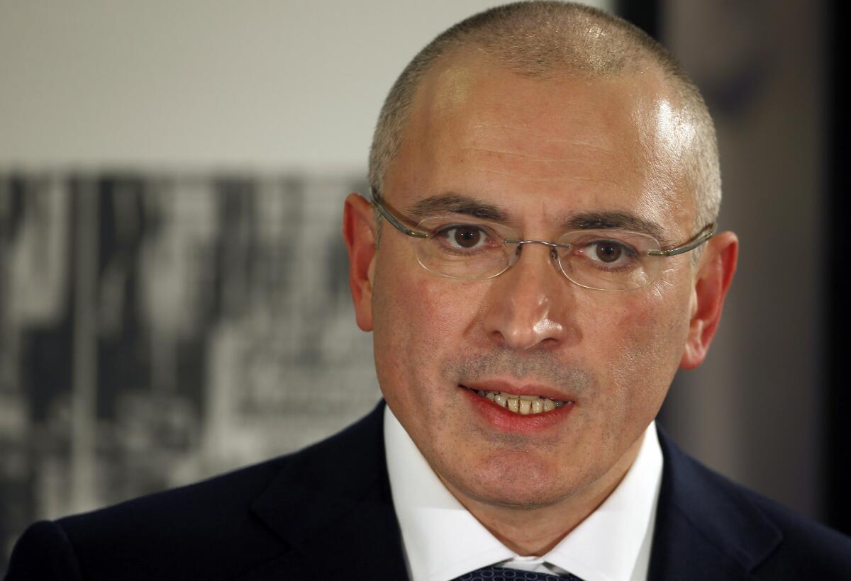 Mikhail Khodorkovsky speaks at a news conference in Berlin on Sunday. The former oil baron and prominent critic of Russian President Vladimir Putin was reunited with his family on Saturday, a day after being released from a decade-long imprisonment in Russia.