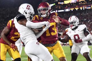 Los Angeles, California September 9, 2023-USC quarterback Caleb Williams pushes his way into the end zone for a touchdown against Stanford in the first quarter at the Coliseum Saturday. (Wally Skalij/Los Angeles Times)
