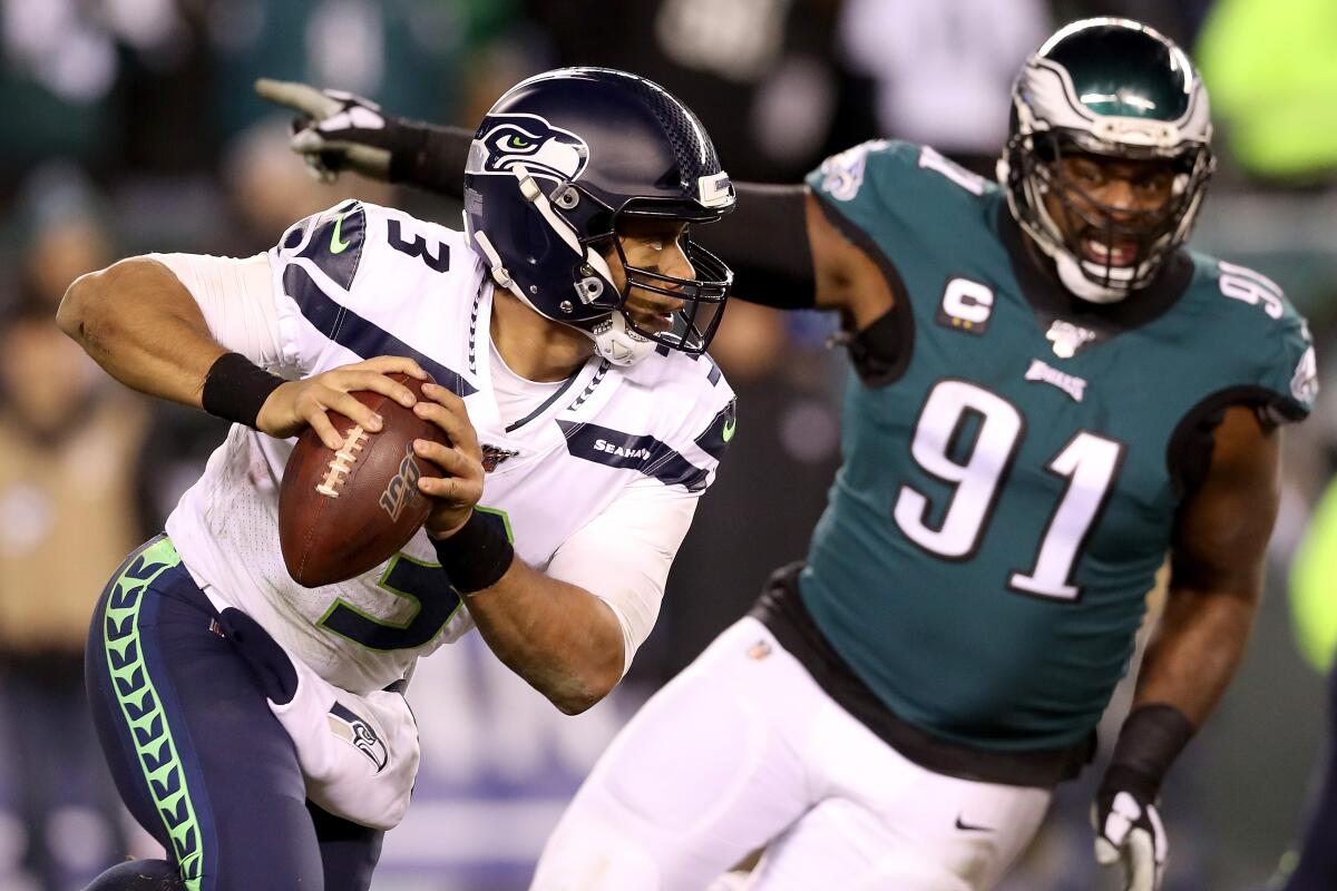 Seattle Seahawks quarterback Russell Wilson runs out of the pocket during Sunday's NFC wild-card win over the Philadelphia Eagles.