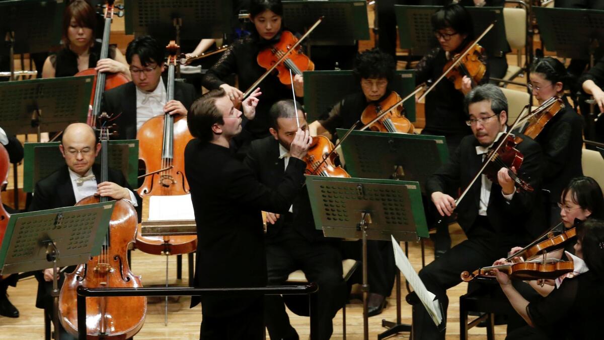 Finland's Pietari Inkinen conducts the Japan Philharmonic Orchestra during their concert at Suntory Hall in Tokyo.