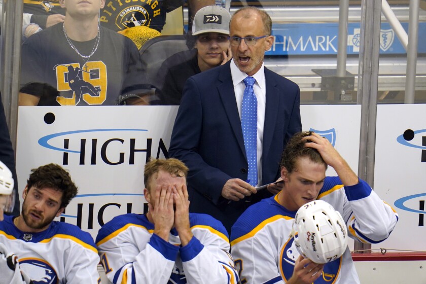 FILE - Buffalo Sabres head coach Don Granato gives instructions during the third period of a preseason NHL hockey game against the Pittsburgh Penguins in Pittsburgh, on Oct. 5, 2021. With Jack Eichel gone, along with the offseason departures of forward Sam Reinhart and defenseman Rasmus Ristolainen, the Sabres can start new with a core of youngsters not tainted by the franchise’s woeful past, and a first-time NHL head coach in Don Granato with a track record of player development. (AP Photo/Gene J. Puskar, File)
