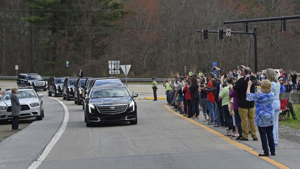 The motorcade carrying the body of the Rev. Billy Graham leaves Asheville, N.C.