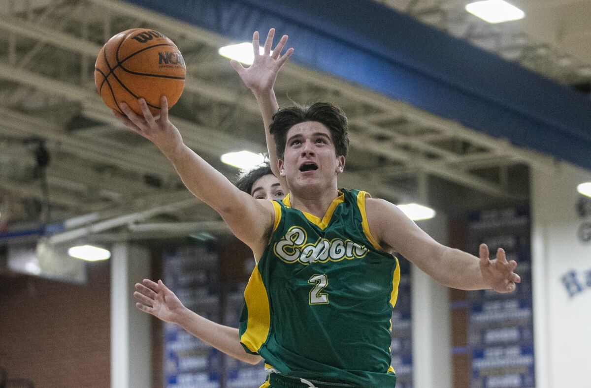 Edison's Dylan Hugues goes up for a shot against Fountain Valley's Parker Rodriguez during Thursday's game.