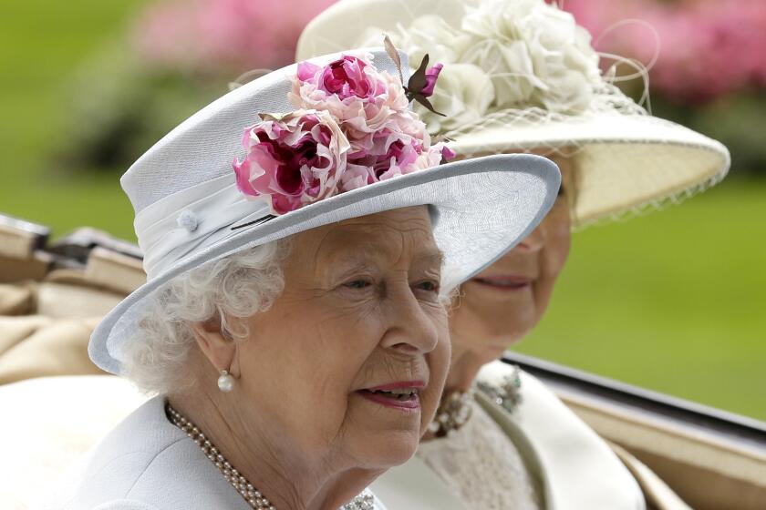 FILE - Britain's Queen Elizabeth II arrives at the parade ring with Princess Alexandra in a horse drawn carriage, on the second day of the Royal Ascot horse race meeting in Ascot, England, Wednesday, June 20, 2018. Queen Elizabeth II is marking her 96th birthday privately on Thursday, April 21, 2022 retreating to the Sandringham estate in eastern England that has offered the monarch and her late husband, Prince Philip, a refuge from the affairs of state. (AP Photo/Tim Ireland, File)