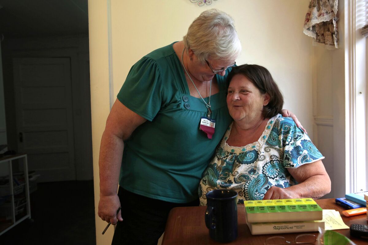 Christine McDonald, right, of Carmel, Maine, was initially skeptical of receiving help from nurse Sally Patterson, but after their visits began she was able to bring her blood sugar under control.