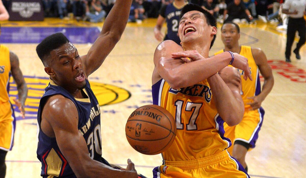 Lakers point guard Jeremy Lin has the ball stripped from him by Pelicans guard Norris Cole in the first half.