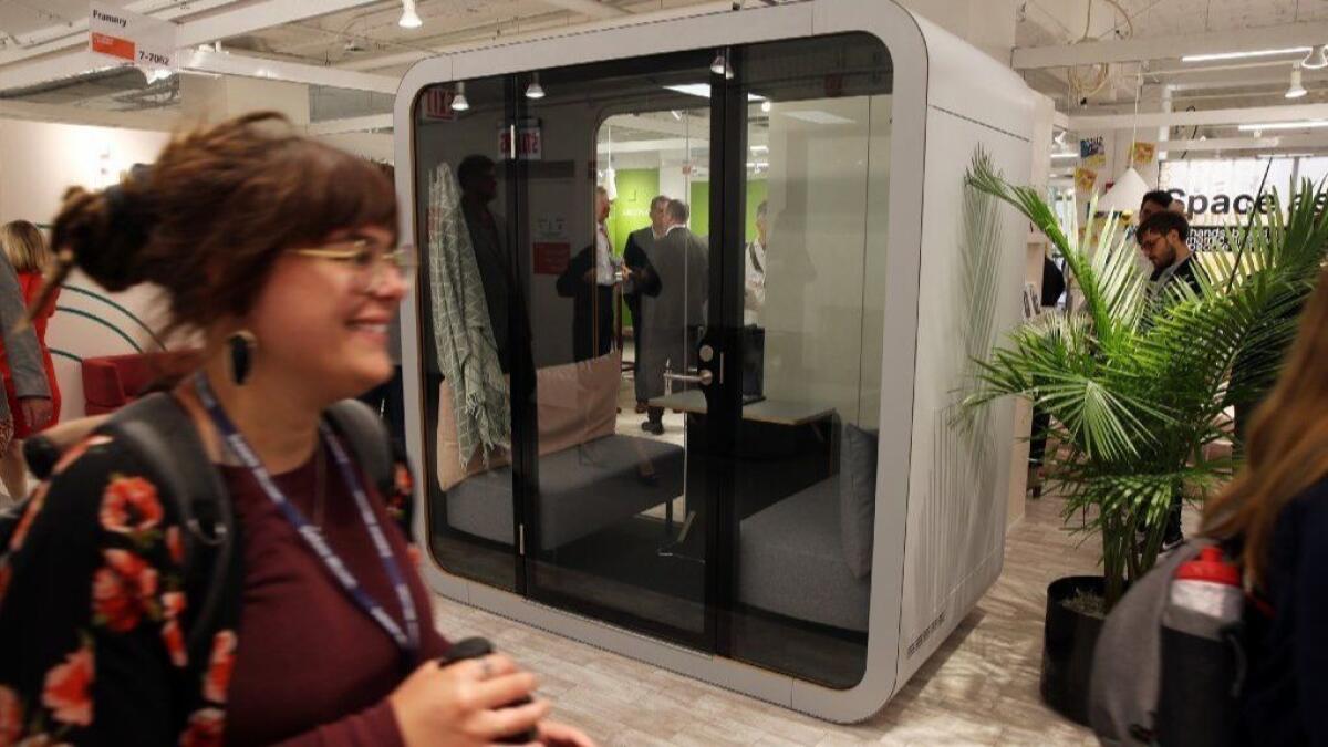 Framery's NapQ, a workstation that folds down into a sofa set, is displayed at a trade show in Chicago in June.