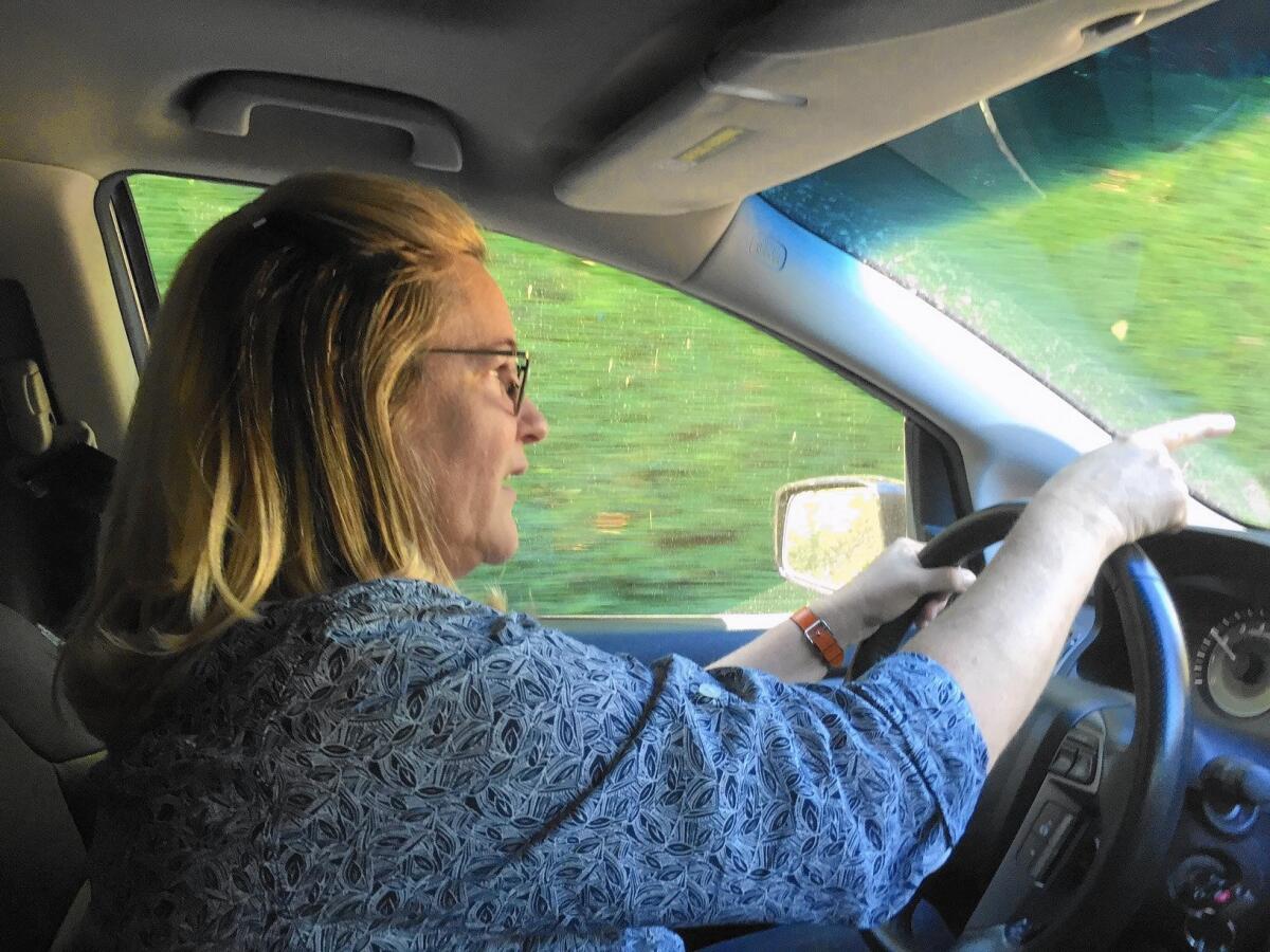 Maureen Levinson, a member of the Bel-Air Beverly Crest Neighborhood Council, does water surveillance on a Tuscan-style villa with a hillside vineyard.