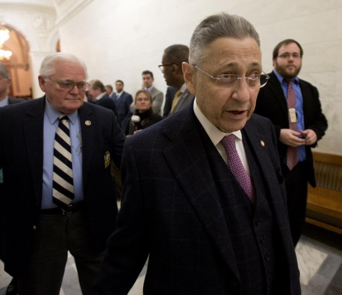 Former Assembly Speaker Sheldon Silver walks through the New York state Capitol shortly before stepping down amid accusations of fraud.