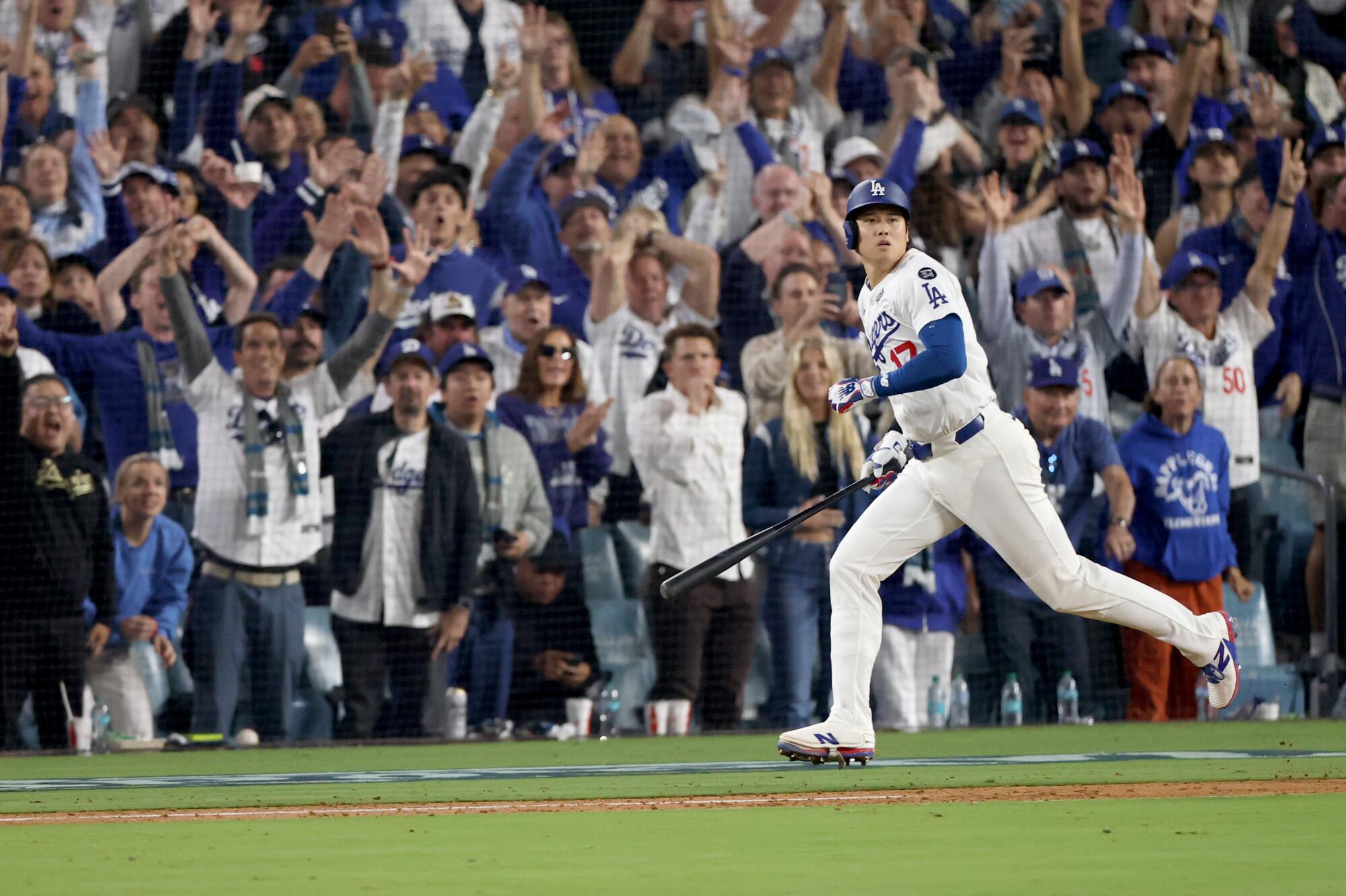 Dodgers star Shohei Ohtani hits a solo home run in the seventh inning — his second homer of the game — to tie the game.
