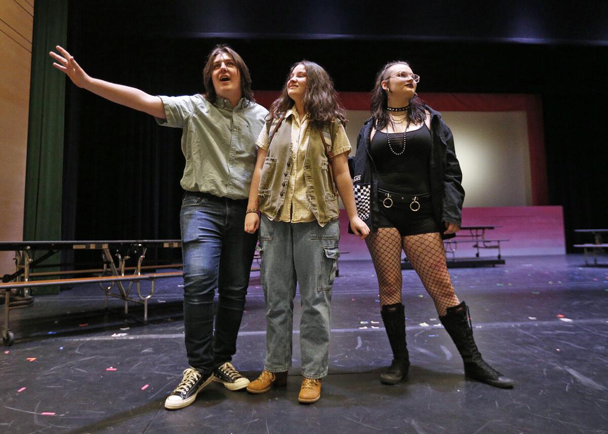 Estancia students Asher Dennee, from left, Helena Solomonian and Jayden Emmitt, rehearse a scene from "Mean Girls" Tuesday.