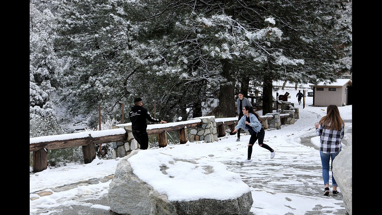 Locals from Burbank and Sunland/Tujunga, including Ray Navasatian, 18, left, enjoy the snow at Redbox Picnic Area in the Angeles National Forest north of La Cañada Flintridge on Tuesday, Feb. 27, 2018. There is snow above 3,000-foot elevation after recent cold storm.