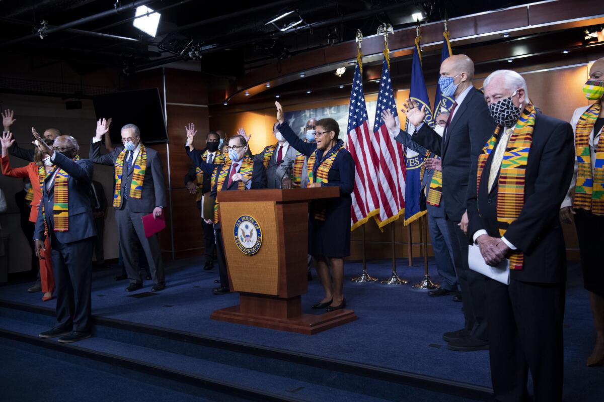 Rep. Karen Bass (D-Los Angeles) and other members of Congress at a news conference to unveil policing reform.