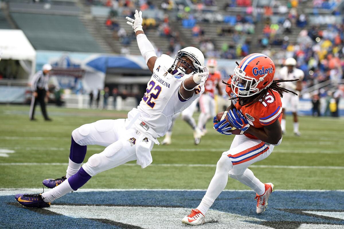 Florida running back Brandon Powell catches a 13-yard pass for a touchdown over East Carolina defensive back Terrell Richardson during the second quarter of the Gators' 28-20 win in the Birmingham Bowl.