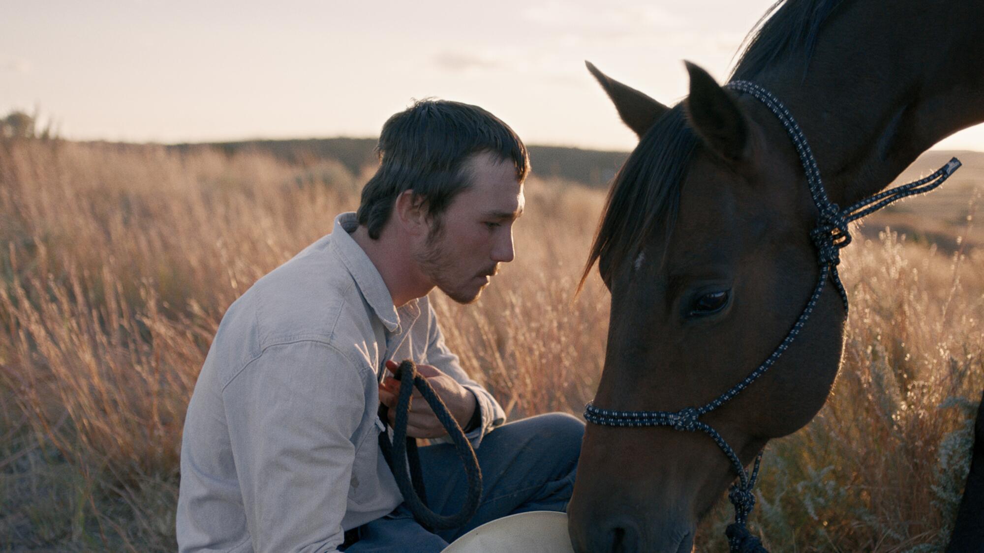 Brady Jandreau with a horse in "The Rider." 