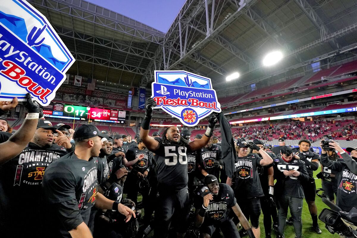 Iowa State players celebrate after the Fiesta Bowl NCAA college football game against Oregon, Saturday, Jan. 2, 2021, in Glendale, Ariz. Iowa State won 34-17. (AP Photo/Ross D. Franklin)