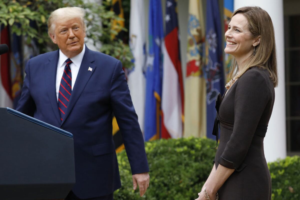 President Trump with Amy Coney Barrett.