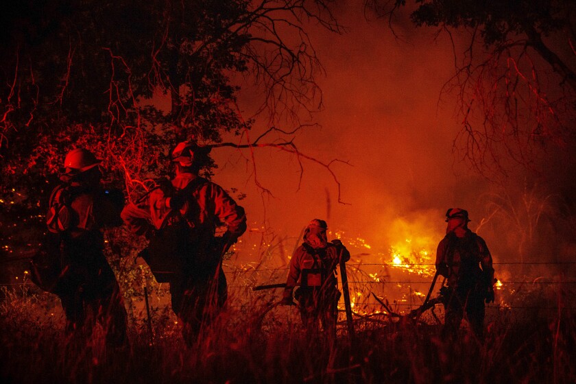 Firefighters work to control the Electra Fire in Mokelumne Hill, in Calaveras County on Tuesday, July 5, 2022.