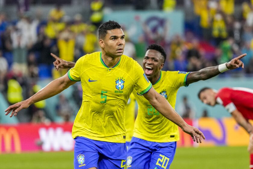Brazil's Casemiro celebrates after scoring his side's opening goal during the World Cup group G soccer match between Brazil and Switzerland, at the Stadium 974 in Doha, Qatar, Monday, Nov. 28, 2022. (AP Photo/Andre Penner)