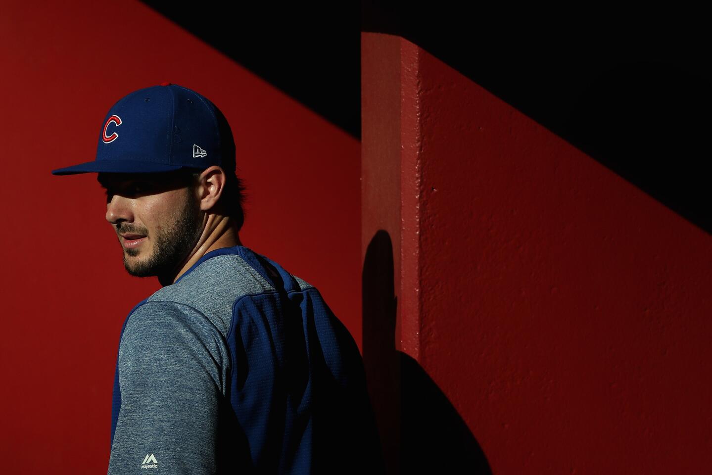 Kris Bryant walks in the dugout before a game against the Diamondbacks at Chase Field on Aug. 11, 2017 in Phoenix.