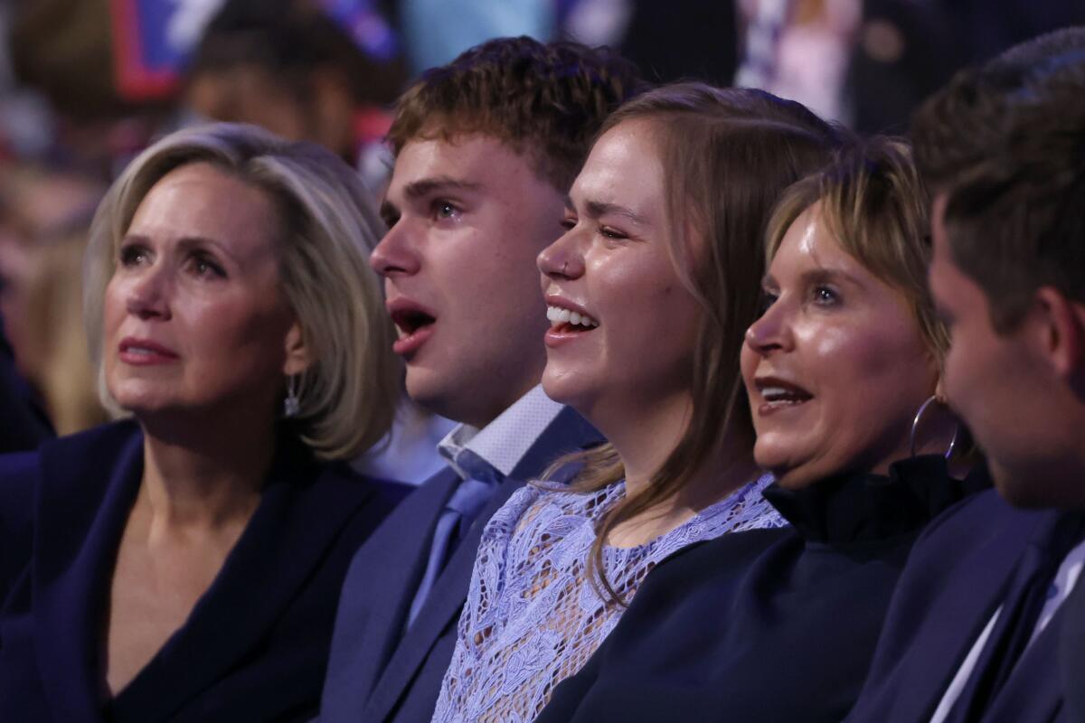 Tim Walz's wife Gwen, left, son Gus and daughter Hope in the crowd