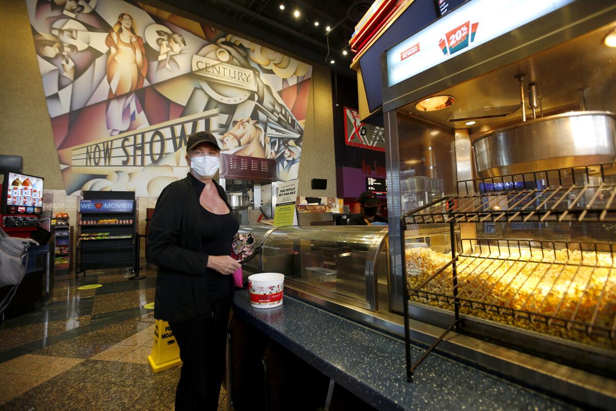 Movie fan Denise Zak of Huntington Beach was glad the Cinemark Century Cinema opened again in Huntington Beach on Friday.