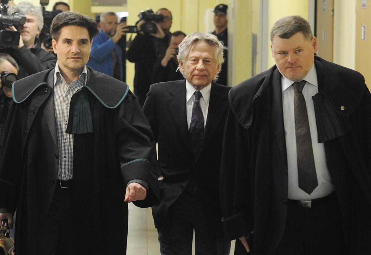Roman Polanski, center, with his lawyers, arriving at the regional court in his childhood city of Krakow, Poland, in 2015.